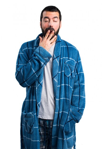 Man in dressing gown yawning