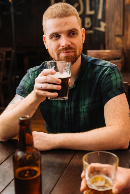 Man drinking beer in bar