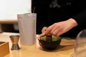 Free photo man drinking matcha tea