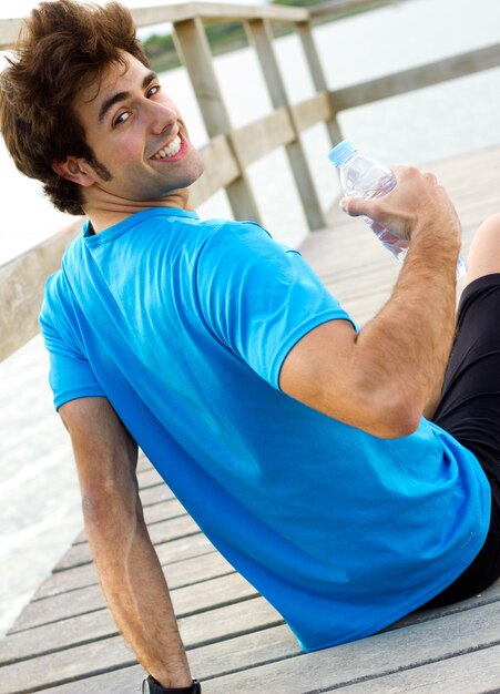 Man drinking water after sport activities