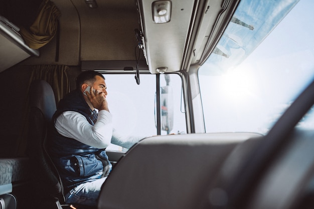 Man driver of the lorry in a logistic company