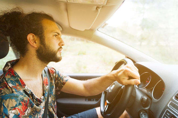 Man driving car inn countryside 