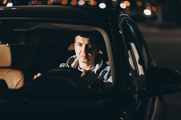 Man driving a car on the road