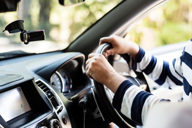 Man driving a family car