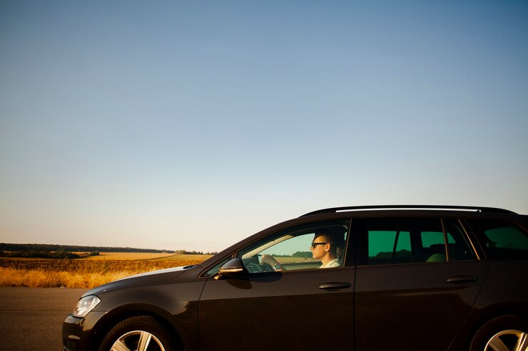 Free Photo man driving on the road