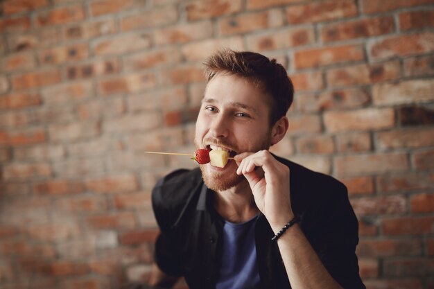 Man eating fruits