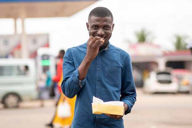 Man eating street food