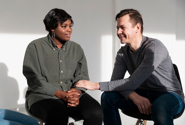 Man encouraging a female patient