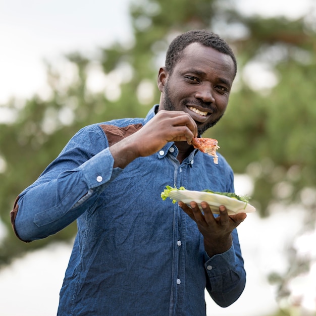 Man enjoying barbecue outdoors