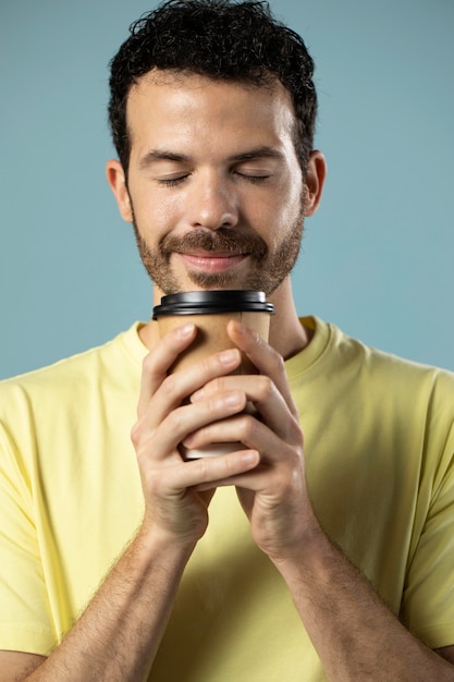 Free photo man enjoying a cup of coffee