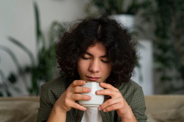 Man enjoying a cup of matcha tea