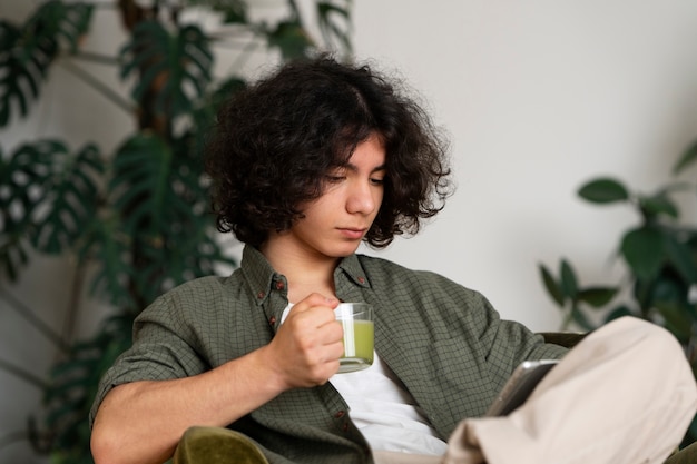 Man enjoying a cup of matcha tea