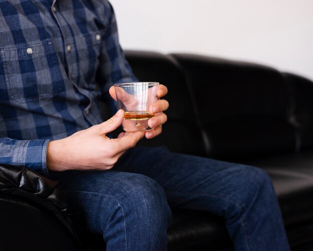 Man enjoying a drink at the barber shop