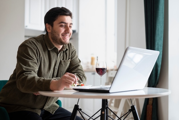 Free photo man enjoying his virtual date