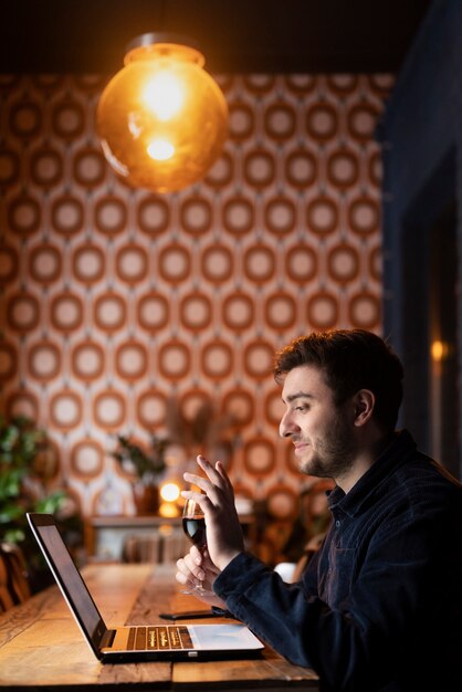 Free photo man enjoying his virtual date