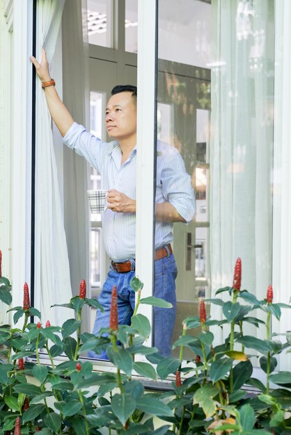 Man enjoying morning with cup of coffee