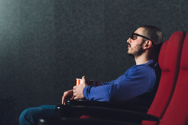 Man enjoying movie in cinema