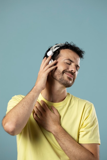 Free photo man enjoying music on headphones