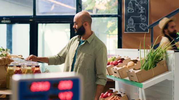 Free photo man examining organic pantry supplies