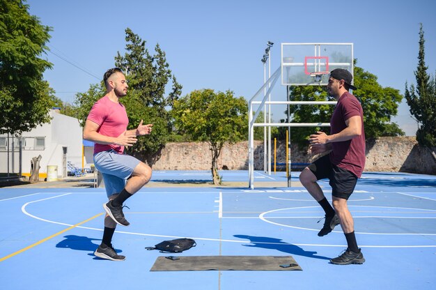 Man exercising with his trainer