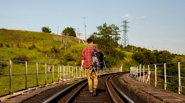 Man exploring train rail