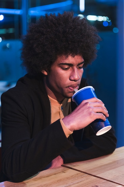 Man in fast food restaurant at night