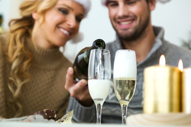 Man filling champagne glasses