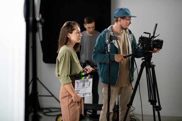 man filming with a professional camera