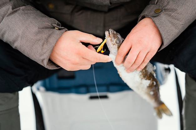 Free photo man fishing alone outside