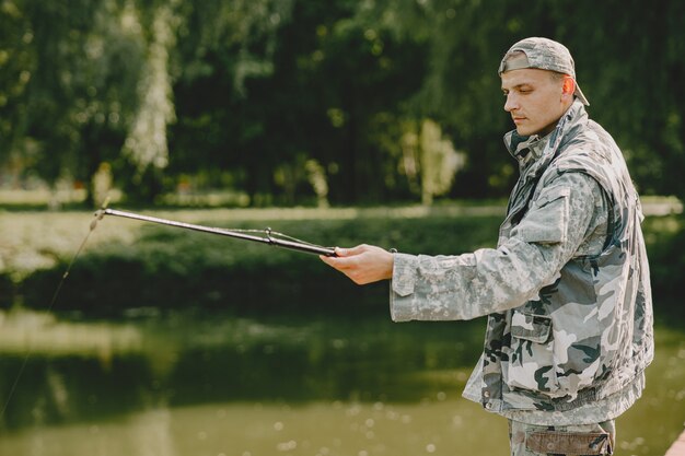 Man fishing and holds the angling rod