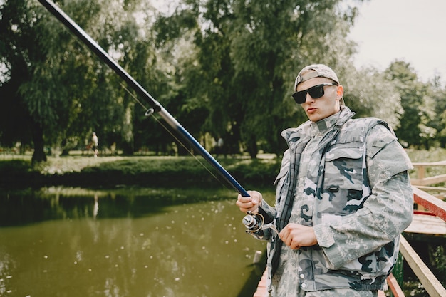 Man fishing and holds the angling rod