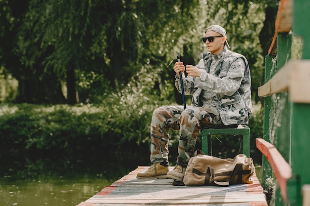 Man fishing and holds the angling rod