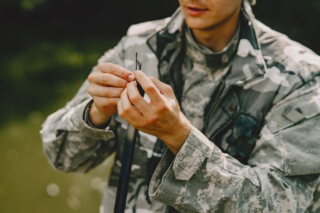 Man fishing and holds the angling rod