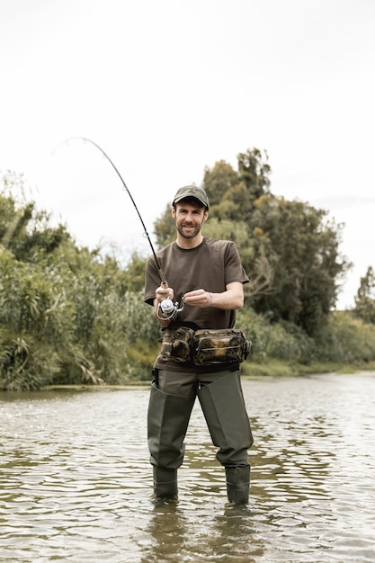 Free photo man fishing at the river