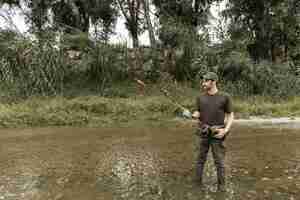 Free photo man fishing at the river