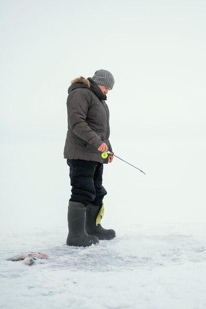 Man fishing with special equipment outside