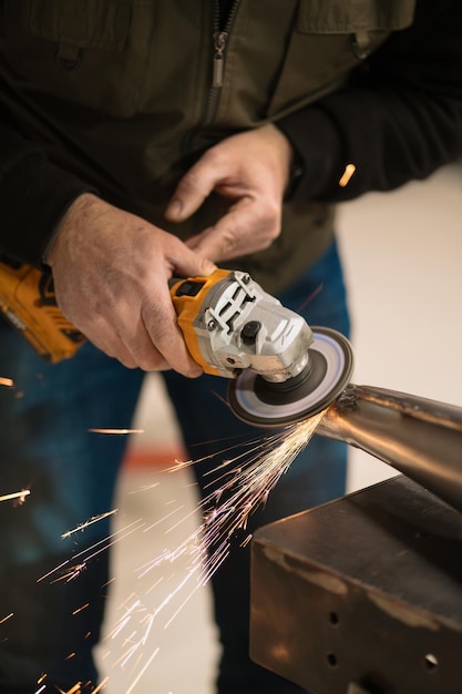 Man fixing a motorcycle in a modern workshop