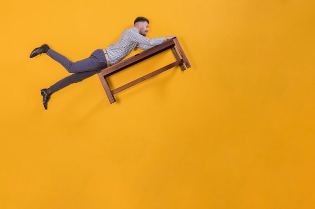 Man floating on a bench