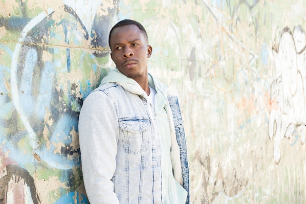 Man in front of concrete wall