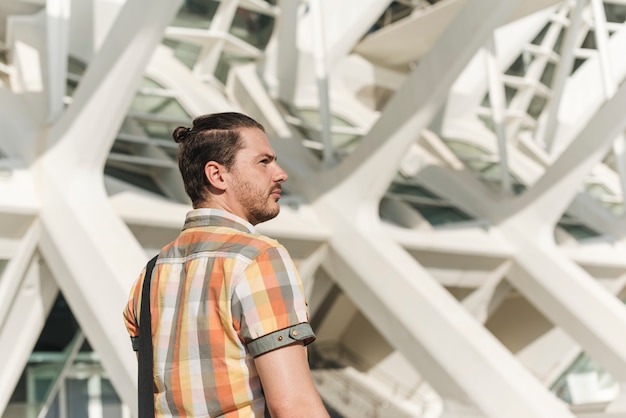 Man in front of modern building