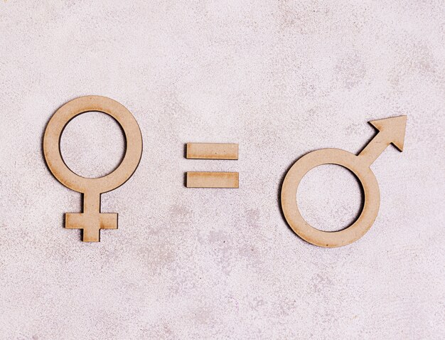 Man gender symbols equals female gender symbol on marble background