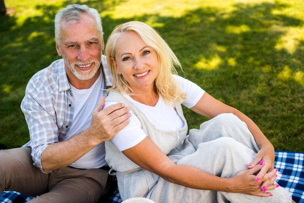 Man gently hugging woman high angle