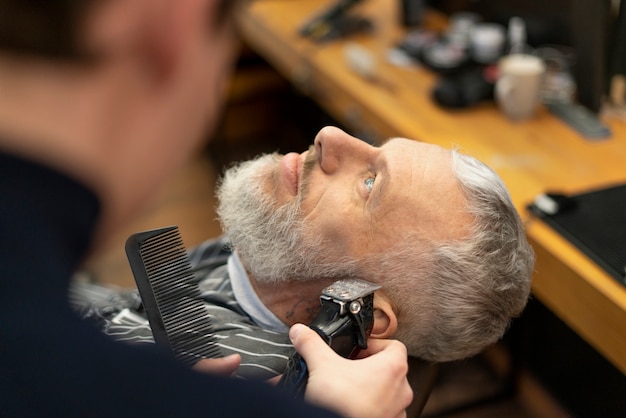 Man getting groomed at salon close up