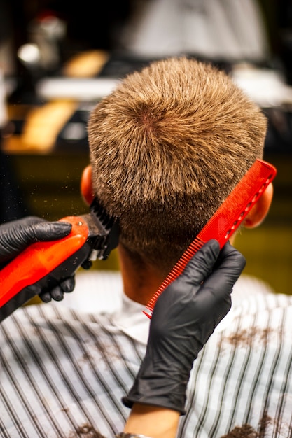 Man getting his hair trimmed and combed