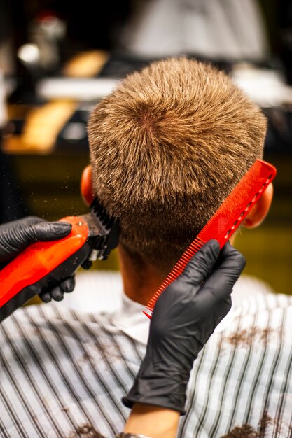 Man getting his hair trimmed and combed