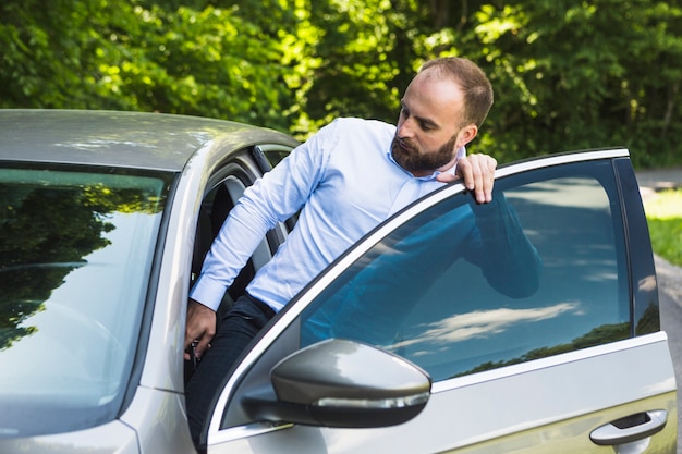 Man getting into his car