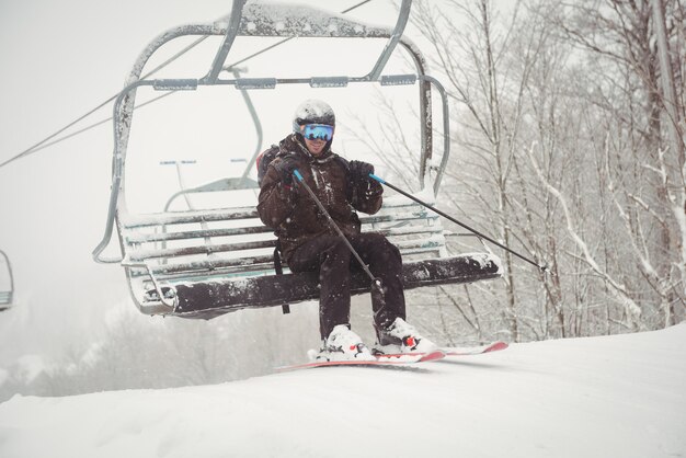 Man getting up of the ski lift