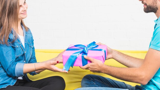Man giving birthday gift to his girlfriend