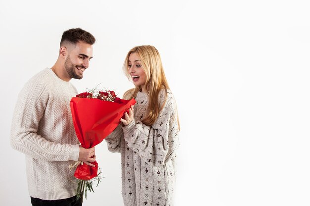 Man giving bouquet to woman