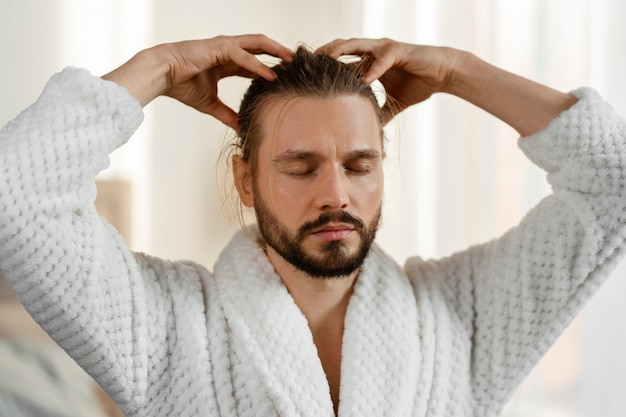 Man giving himself  scalp massage